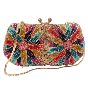 Detailed close-up of rainbow crystal floral evening clutch with gold chain strap