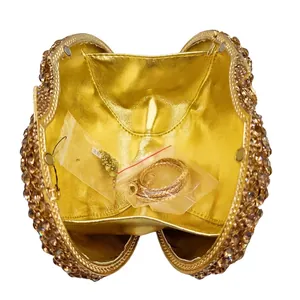 Golden luxury crystal evening clutch with sparkling rhinestones and chain strap