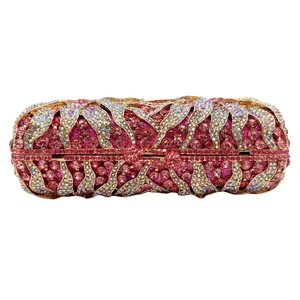 Close-up of pink and iridescent crystal-encrusted hollow flower clutch with gold frame