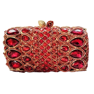 Detailed view of red rhinestone clutch with golden leaf clasp and luxury gemstone inlay