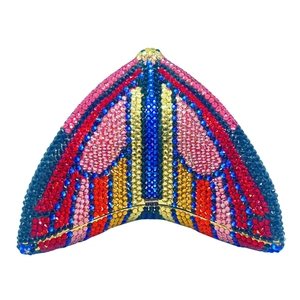 Detailed view of colorful crystals set on a triangular evening clutch with metal clasp
