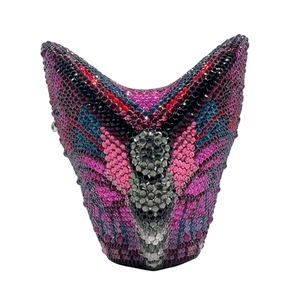 Detailed macro view of V-shaped butterfly evening clutch with multi-colored crystals
