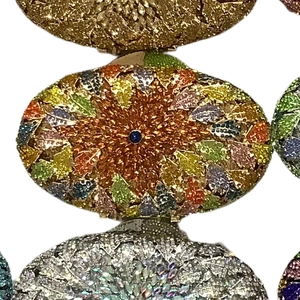 Detailed stack of rhinestone clutch bags with floral crystal inlay and gemstone accents