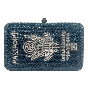 Close-up of deep blue crystal passport clutch bag with detailed American emblem