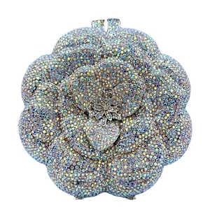 Detailed macro view of the rose-shaped dinner clutch with rainbow crystals and silver frame