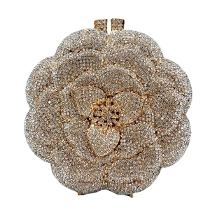 Detailed view of the luxury camellia-shaped evening clutch with sparkling pavé crystals