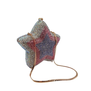 Macro shot of silver and pink crystal star-shaped clutch bag with luxury rhinestones