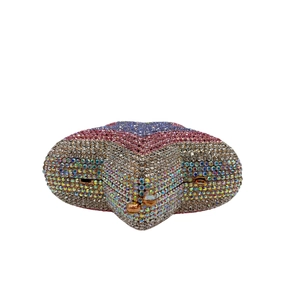 Detailed view of the star-shaped evening clutch with multi-colored rhinestones and gold clasp