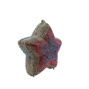Detailed side view of star-shaped evening clutch with gradient purple and pink rhinestones