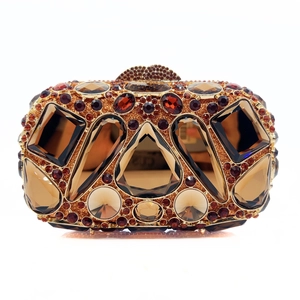 Macro view of luxury clutch bag featuring amber diamonds and geometric crystals