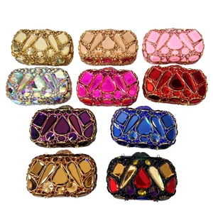 Detailed top view of luxury hard-shell stone clutch bags in ten vibrant crystal colors