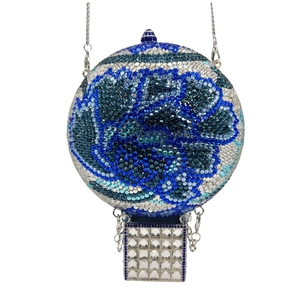 Detailed macro view of crystal-encrusted hot air balloon evening clutch bag with blue flowers