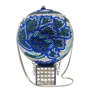 Detailed close-up of hot air balloon crystal evening bag with blue and white rhinestones