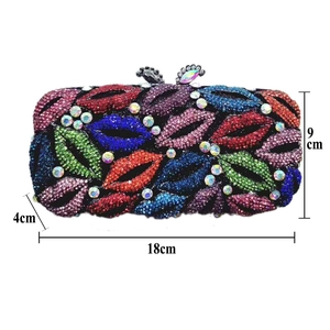 Detailed size view of luxury clutch bag with crystal lip pattern and 18cm dimensions
