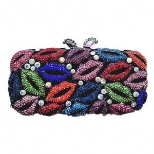 Detail of colorful crystal rhinestone lip pattern on hollow out metal clutch bag