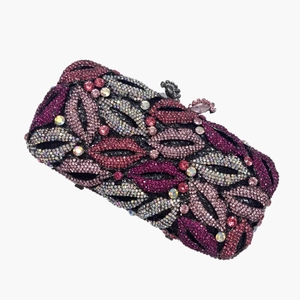 Close-up of luxury metal clutch with pink and purple rhinestone lip pattern and top clasp