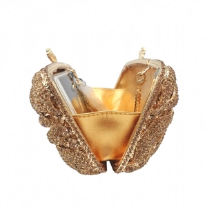 Lip-shaped evening clutch with sparkling champagne crystals and golden metal chain detail