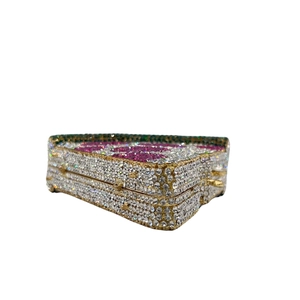 Macro detail of pizza-shaped evening clutch with sparkling rhinestones and gold frame