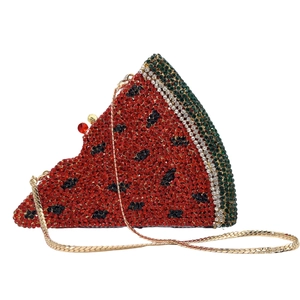 Macro view of crystal-encrusted watermelon clutch showing detailed rhinestones and gold chain