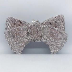Bow-shaped crystal clutch evening bag with silver rhinestones and a metal frame