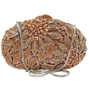 Macro shot of silver evening clutch bag with sparkling diamond leaf floral pattern