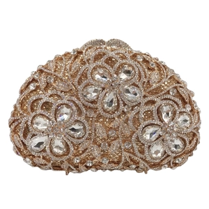 Detailed macro view of champagne gold floral evening bag with sparkling rhinestones