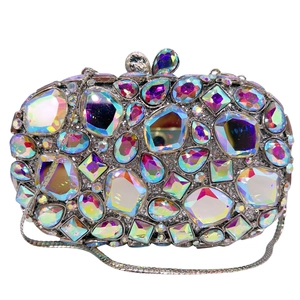 Close-up of luxury hollow glass crystal clutch with AB diamonds and silver metal chain