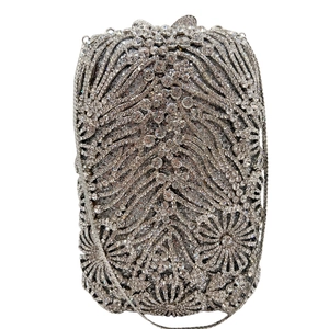 Elegant silver crystal clutch bag with radiant floral rhinestone pattern and chain strap