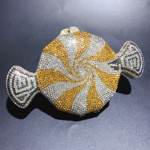 Detailed macro view of candy shaped evening clutch with gold and silver rhinestone inlay