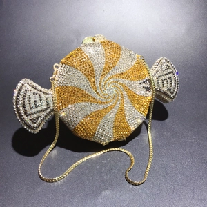 Detailed close-up of candy-shaped luxury evening bag with gold and silver rhinestones