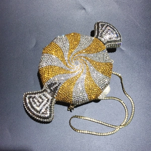 Candy-shaped evening clutch bag with sparkling multicolor crystals and golden chain