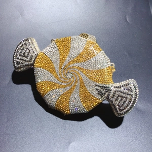 Detailed close-up of candy clutch bag with spiral crystal rhinestones and metal clasp