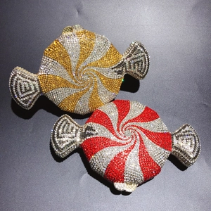 Close-up of candy-shaped evening clutch bags with sparkling rhinestones and metal frames