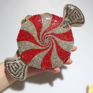 Macro detail of red and silver rhinestone candy clutch bag with metallic frame
