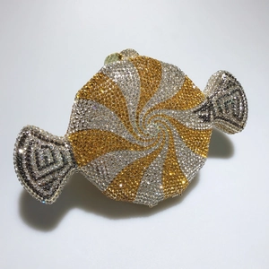 Detailed view of candy-shaped clutch bag with silver and gold sparkling rhinestones