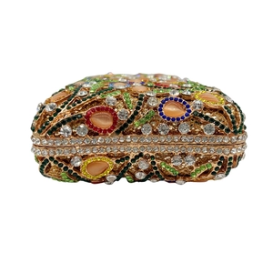 Luxurious hollow evening bag with multi-colored rhinestones and gold metal frame