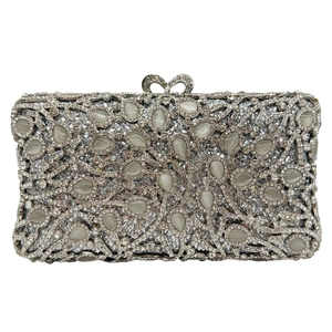 Luxury silver evening clutch with rhinestones, cat eye stones and bow clasp for weddings