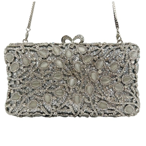 Close-up of silver evening clutch with sparkling rhinestones and teardrop stones