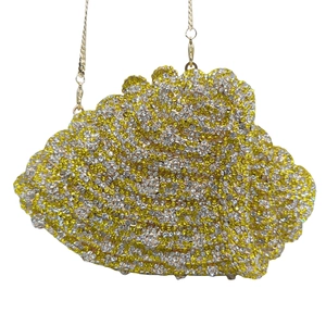 Macro detail of the sparkling gold and silver rhinestones on the conch clutch