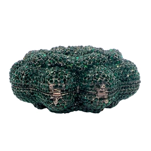 Detailed close-up of green crystal evening clutch with floral shape and sparkling rhinestones