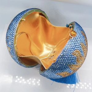 Luxurious spherical moon rhinestone clutch with blue and gold crystals and long tassel