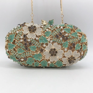 Luxurious floral rhinestone clutch bag with green and silver crystals on gold metal frame