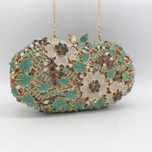 Elegant floral crystal clutch bag with green rhinestones and butterfly clasp for parties