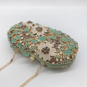 Exquisite floral crystal clutch bag with pale green rhinestones and golden chain strap