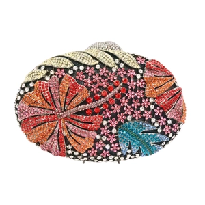 Detailed close-up of oval clutch bag featuring colorful floral rhinestone embroidery