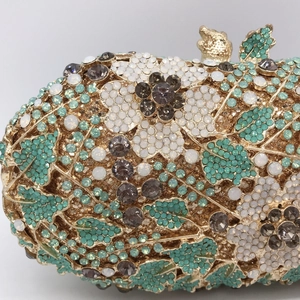 Luxurious evening clutch purse with white floral rhinestones and mint green leaf gems