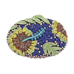 Macro detail of multicolored rhinestone floral pattern on elegant clutch evening bag