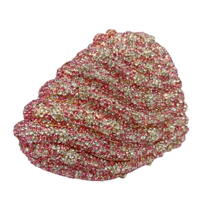 Macro shot of seashell clutch bag with shimmering pink and silver rhinestones