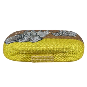 Elegant clutch bag with glittering yellow and brown crystals and gold metal frame