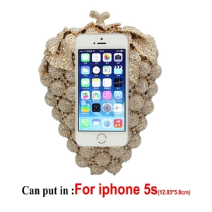 Luxurious gold grape-shaped clutch bag encrusted with rhinestones for evening gala events